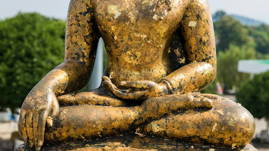 hand of Buddha statue. The peace of the Buddha. Statue of Buddha sitting in meditation